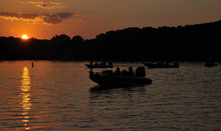 Airmen assigned to McConnell Air Force Base, Kan., and American Bass Anglers members wait for the start of a fishing tournament, June 11, 2016, at Big Hill Lake in Cherryvale, Kan. Airmen spent eight hours on the lake fishing alongside ABA members during this year’s Take an Airman Fishing event. (U.S. Air Force photo/Airman Erin McClellan)