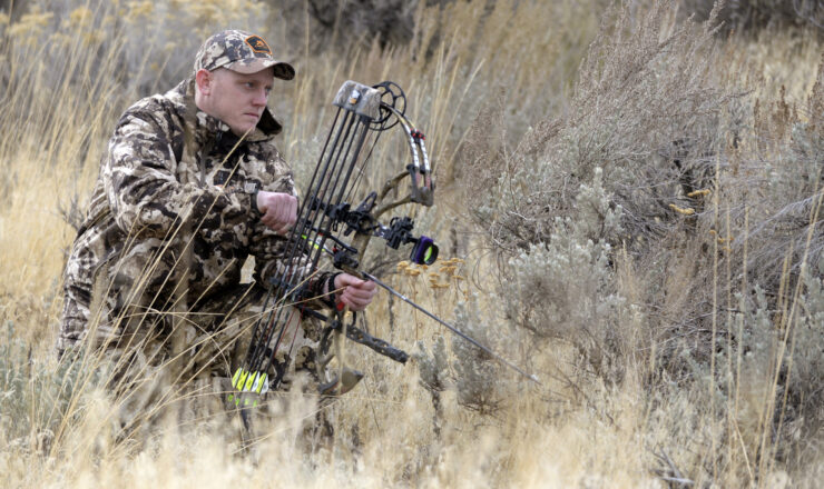 Air National Guard Staff Sgt. Jeff Hopkin, T-70th Air Traffic Control Squadron, Kingsley Field, Oregon, poses while hunting deer at Hill Air Force Base, Utah, Nov. 14, 2017. Hopkin drew one of 10 available vouchers to hunt during one of the base’s four archery deer seasons and was successful in harvesting a three-point buck. (U.S. Air Force photo by Todd Cromar)