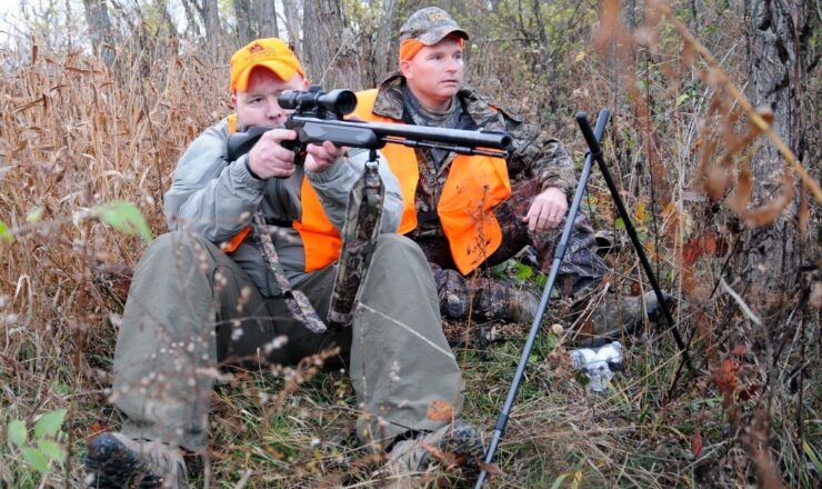 Master Sgt. David Glenn (left), a soldier with the Wounded Warrior Program, sites in on a deer with the help of Capt. Stephen Spencer, an agriculture officer at Muscatatuck Urban Training Center for the Indiana National Guard, during the Wounded Warrior Hunt at Camp Atterbury Joint Maneuver Training Center, Nov. 15.