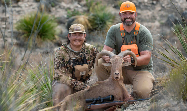 U.S. Army Veterans Gary Price and Chance Bailey pose with an Aoudad sheep after the hunt on Fort Bliss, Texas grounds, September 14, 2024. Fort Bliss offers a lottery system for both military personnel and civilians to participate in outdoor hunting activities while contributing to conservation efforts in the region. (U.S. Army photo by Staff Sgt. Wheeler Brunschmid).