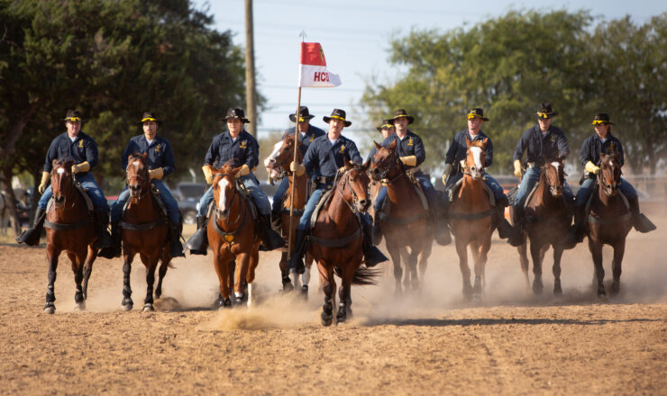 The 1st Cavalry Division Horse Cavalry Detachment rides in formation Oct. 17, 2024. at Fort Cavazos, Texas. First Team troopers have been preserving the traditions of the U.S. cavalry, performing drills and ceremonies at events for more than 50 years. (U.S. Army photo by Scott Darling, Fort Cavazos Public Affairs)