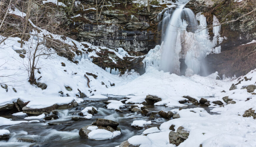 Plattekill Falls and creek slowly thawing out after a big March snowstorm in Platte Clove in the Catskills Mountains of New York