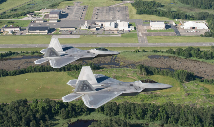 Two U.S. Air Force F-22 Raptors fly over Joint Base Langley-Eustis’ Felker Army Airfield at Fort Eustis, Virginia, June 14, 2018. Felker Army