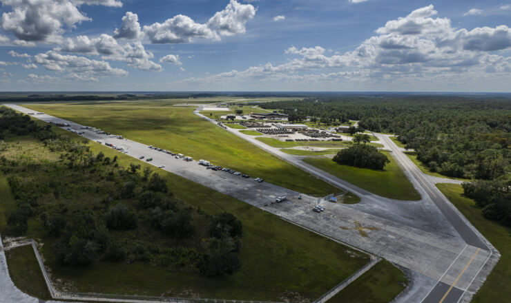 U.S. Army Corps of Engineers and Flathead Interagency Hotshot Crew personnel stage Hurricane Ian disaster relief operations out of Avon Park Air Force Range, Florida, Oct. 3, 2022. The Flathead Hotshots provided roadway clearance of downed trees and debris while USACE provided generators to power hospitals, shelters, assisted living facilities, fire stations, police stations and more. (U.S. Air Force photo by Staff Sgt. Devin Boyer)
