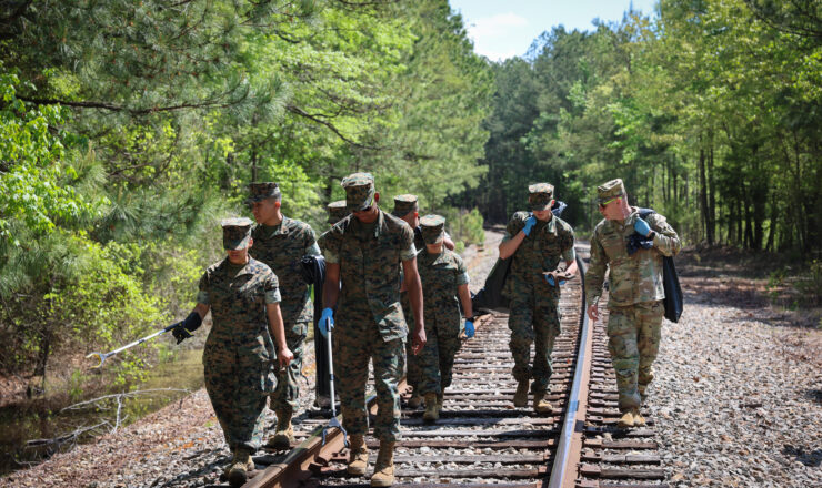 James D. Hoyman, Garrison Commander talks with Fort Gregg-Adams Marines during Earth Day Cleanup, April 22, 2024.