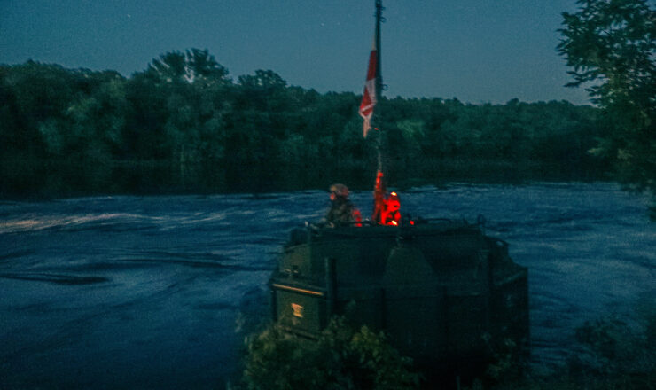 Soldiers from the 1437th Engineer Multi-Bridge Company out of Michigan conducted night operation wet gap crossing operations in joint with the 333rd and 233rd Military Police Company out of Illinois across the Mississippi River at Camp Ripley Training Center in Little Falls, Minnesota, on June 11th through the 12th, 2024. The engineers completed the bridge across the Mississippi while the Military Police conducted security from opposing forces on both sides of the river and from boats on the river (Minnesota National Guard Photo by Army Staff Sgt. Jorden Newbanks).